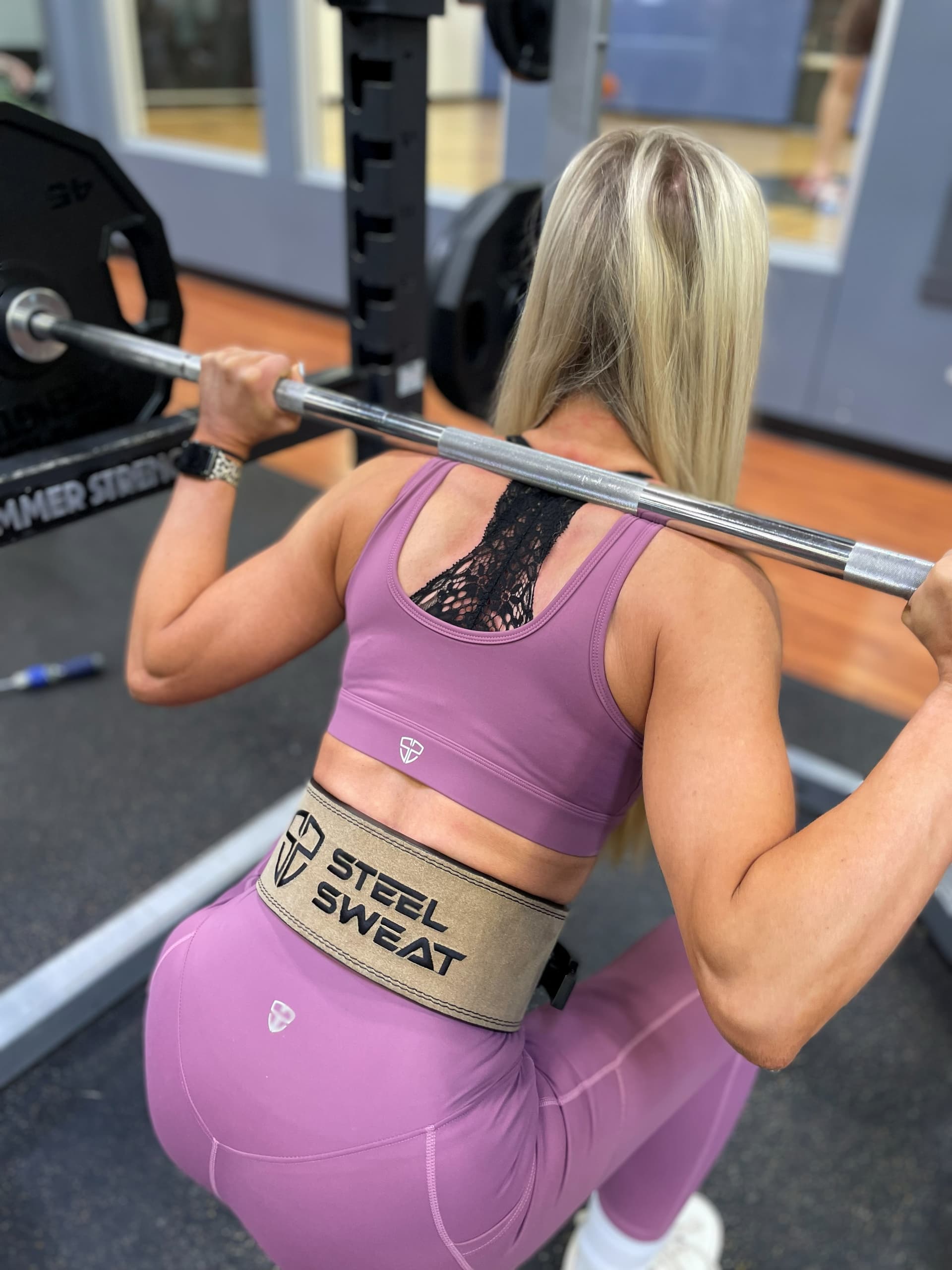 Tan lever belt worn for a squat